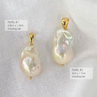 Two excellent quality large baroque pearl pendants with gold bail settings.