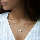 Single floating south sea pearl on silver chain