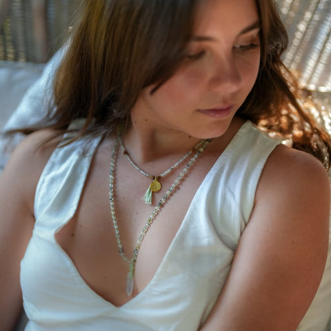 Spiritual layering jewellery on beautiful woman