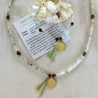 Fine prehnite crystal necklace with Buddhist charm